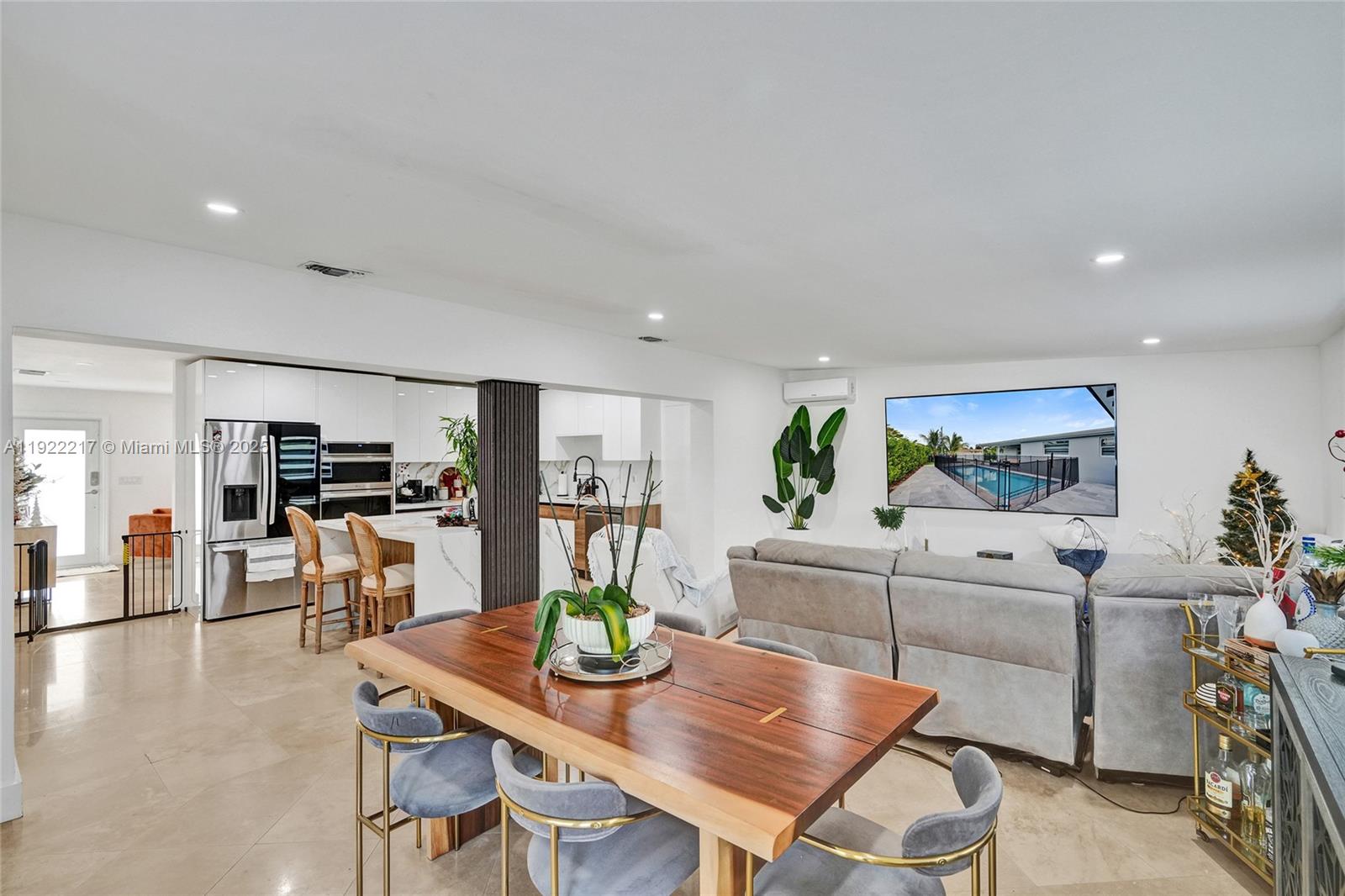 10401 Southwest 53rd Street Miami, FL 33165 - Photo 38 of 50 a kitchen with stainless steel appliances kitchen island granite countertop a sink and cabinets