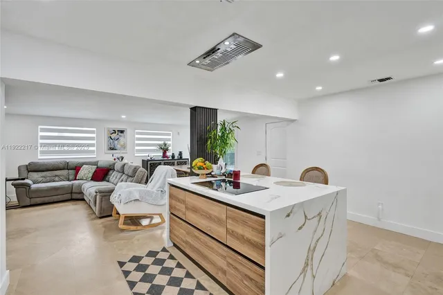 a view of living room with furniture and window