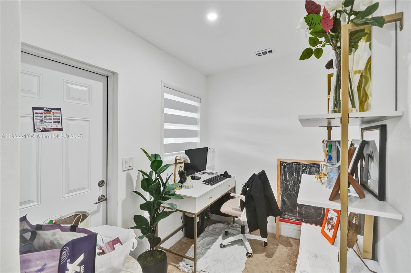 10401 Southwest 53rd Street Miami, FL 33165 - Photo 41 of 50 a view of a workspace with furniture and a potted plant