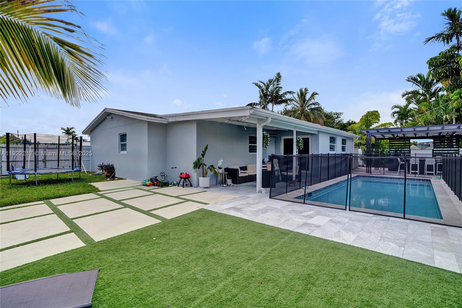 10401 Southwest 53rd Street Miami, FL 33165 - Photo 42 of 50 a view of a house with a yard patio and swimming pool
