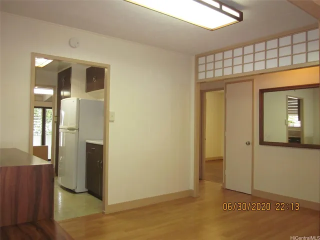 a view of livingroom with hardwood floor and hallway