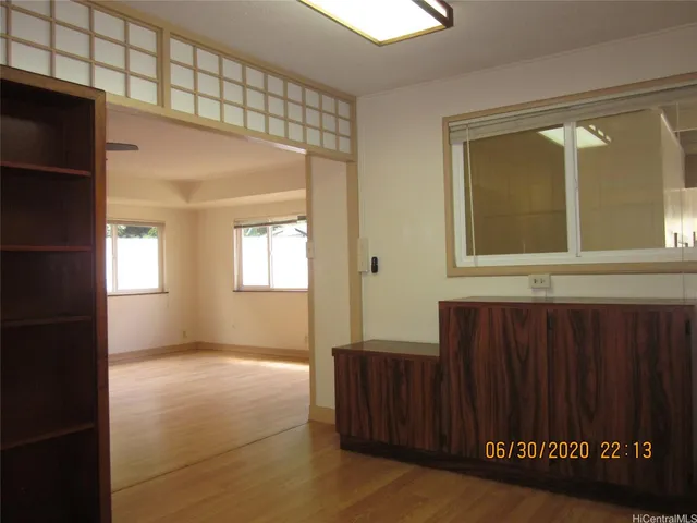 a view of an empty room with a window