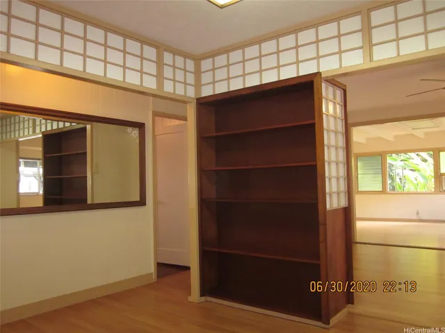 a view of a door and an empty room