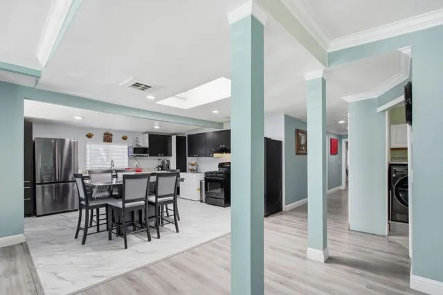 a view of a dining area with furniture and wooden floor