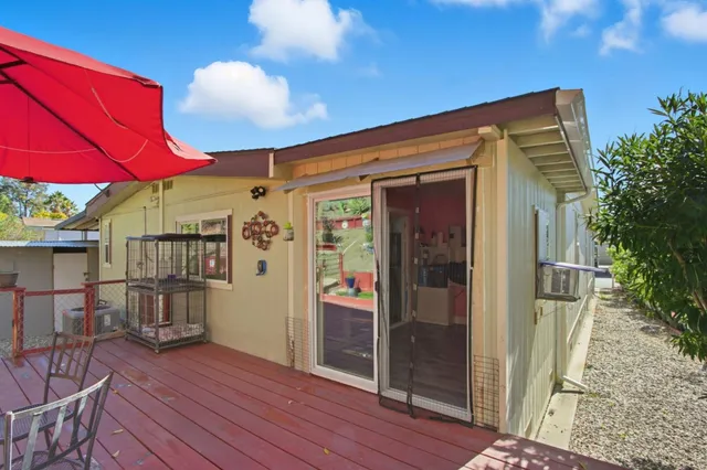 a view of balcony with outdoor seating and wooden floor