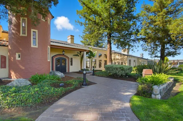 a view of a livingroom with furniture and a window