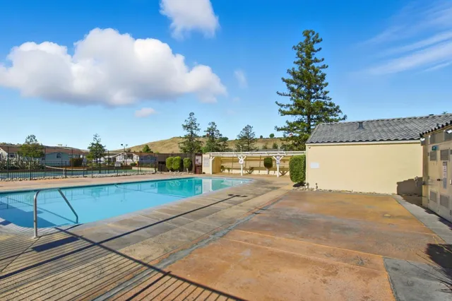 a view of a backyard with iron fence