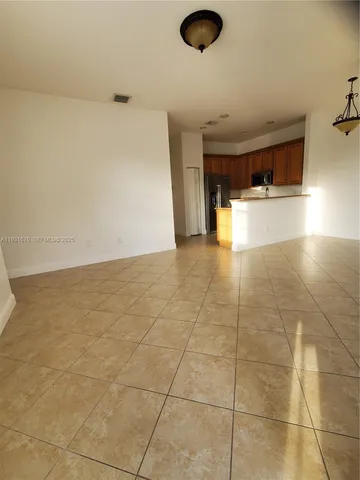 a view of a kitchen with a sink