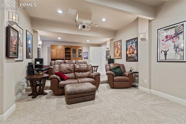8 Pine Road Colorado Springs, CO 80906 - Photo 6 of 19 Living room with light carpet