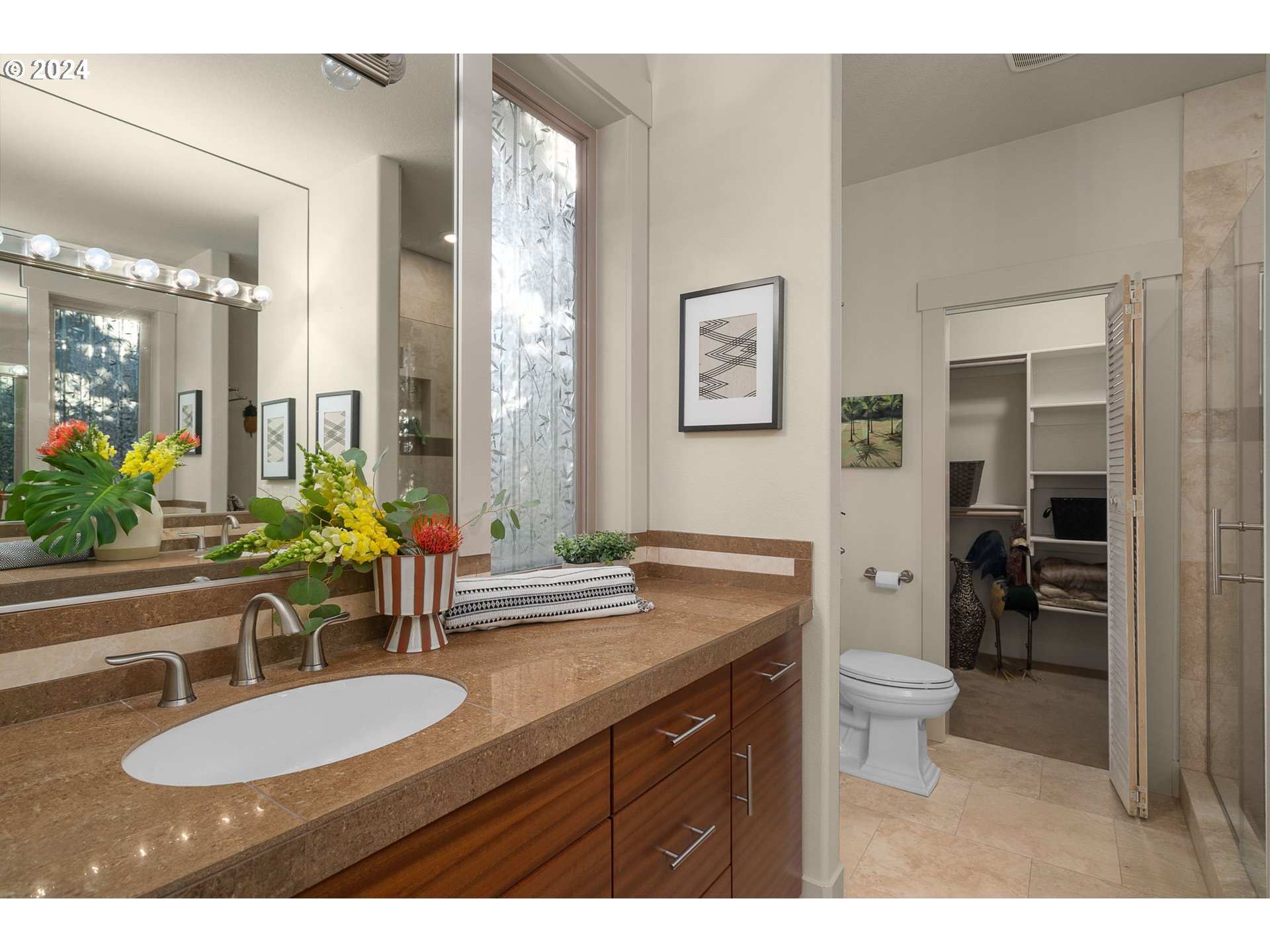 1011 Columbia Ridge Drive Vancouver, WA 98664 - Photo 21 of 34 a bathroom with a granite countertop sink a toilet a mirror and shower
