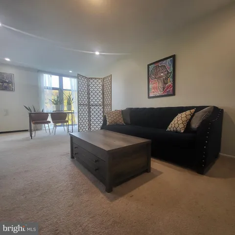 a living room with furniture and a couch