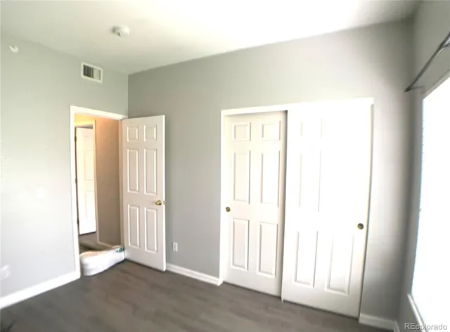 a view of a livingroom with wooden floor