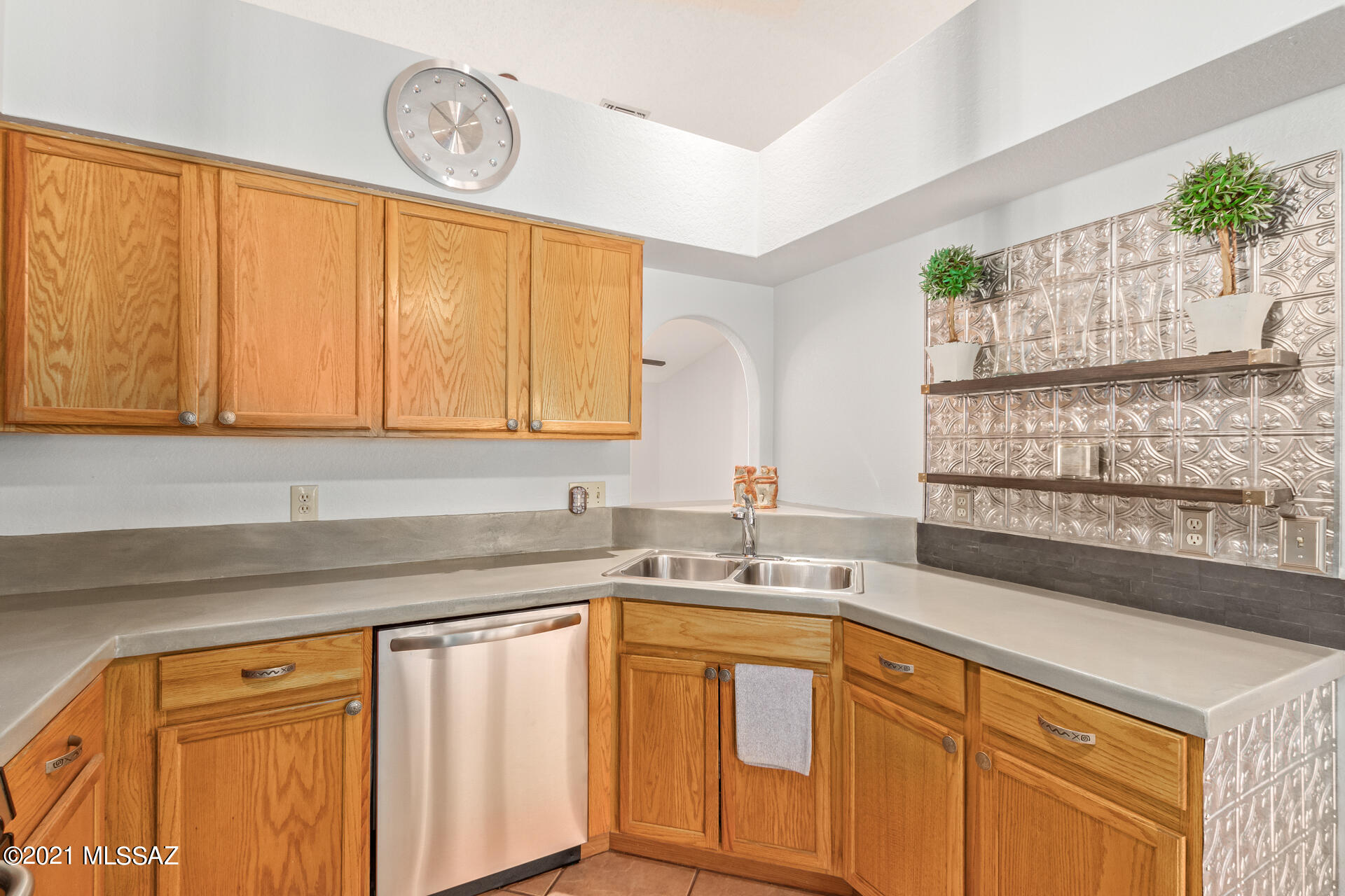 3034 West Sky Ranch Trail Tucson, AZ 85742 - Photo 12 of 27 a kitchen with stainless steel appliances granite countertop a sink window and cabinets