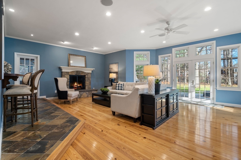 4 Plainview Road Wayland, MA 01778 - Photo 13 of 30 a living room with furniture a fireplace and a chandelier