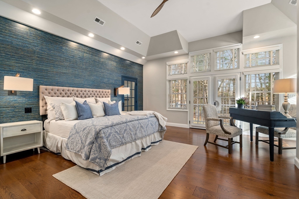 4 Plainview Road Wayland, MA 01778 - Photo 14 of 30 a spacious bedroom with a bed a table and large windows