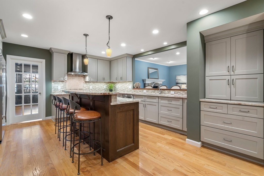 4 Plainview Road Wayland, MA 01778 - Photo 7 of 30 a kitchen with a table chairs refrigerator and cabinets