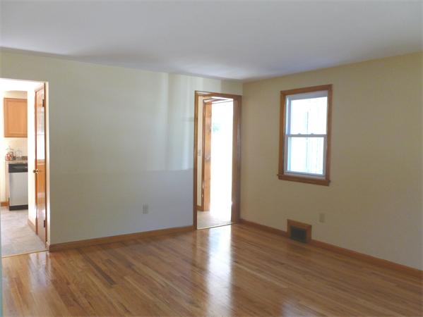63 Timothy Circle Springfield, MA 01119 - Photo 7 of 24 an empty room with wooden floor and windows