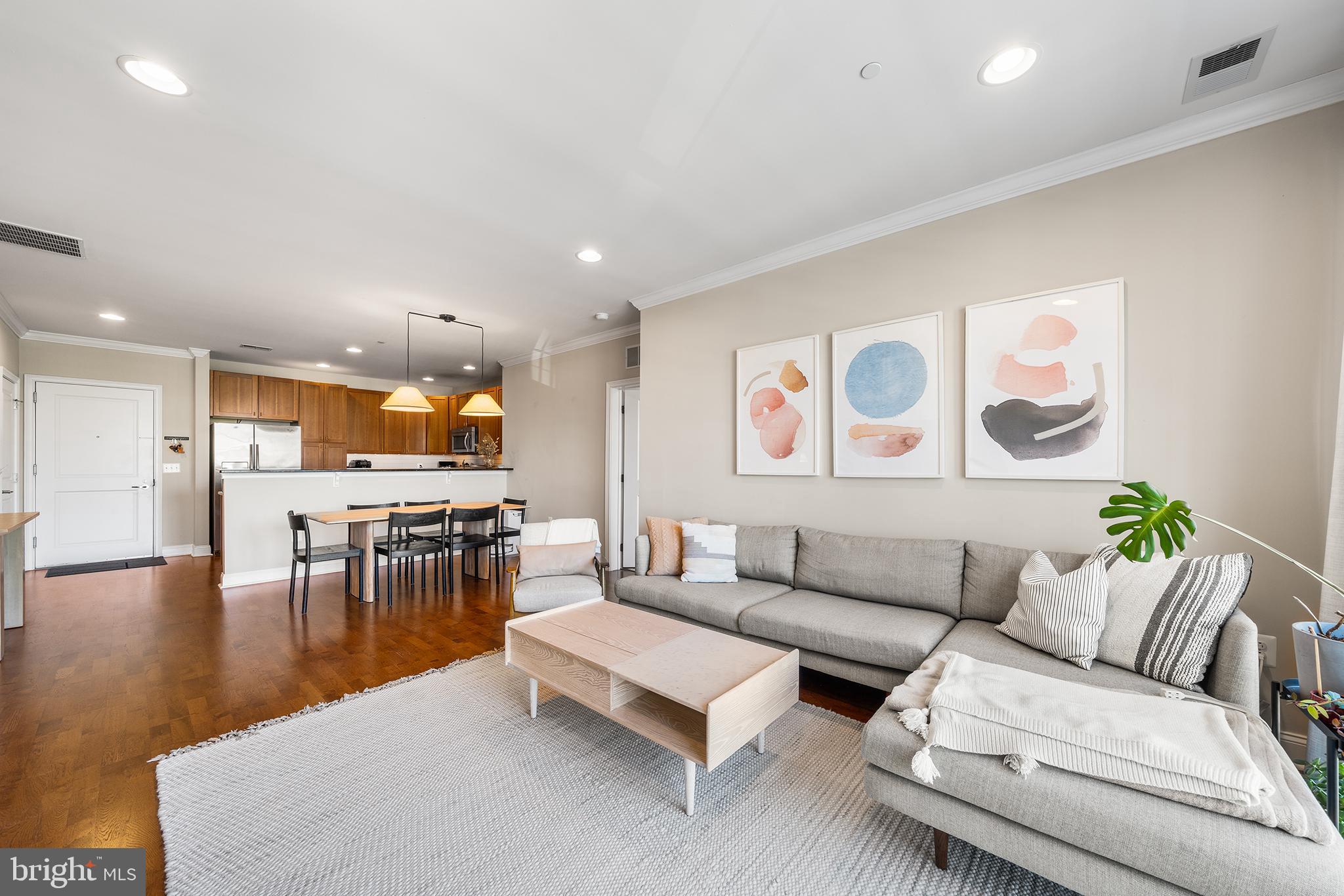 700 Commodore Court, Unit 2718 Philadelphia, PA 19146 - Photo 3 of 36 a living room with furniture and kitchen view