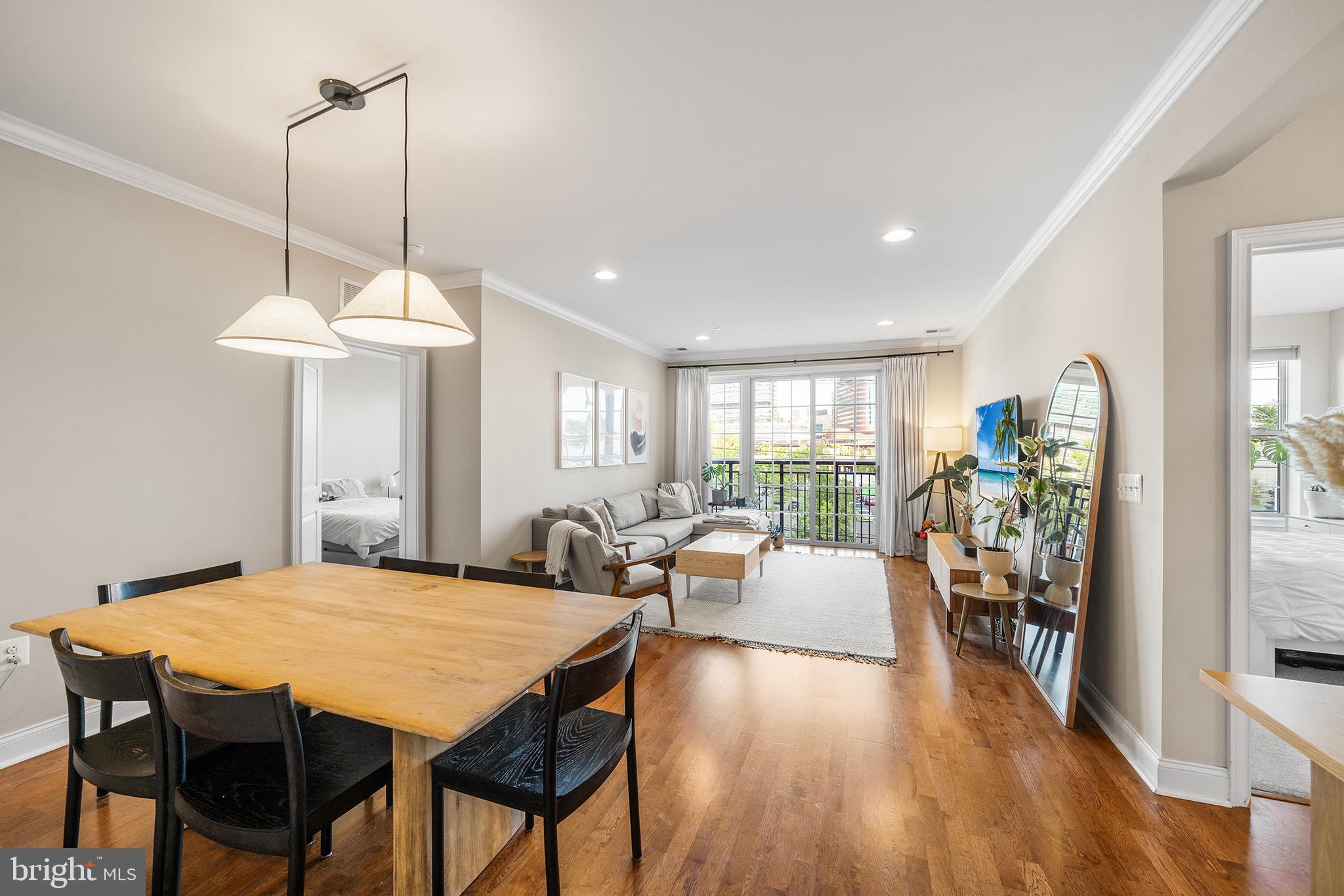 700 Commodore Court, Unit 2718 Philadelphia, PA 19146 - Photo 7 of 36 a view of a dining room with furniture window and wooden floor