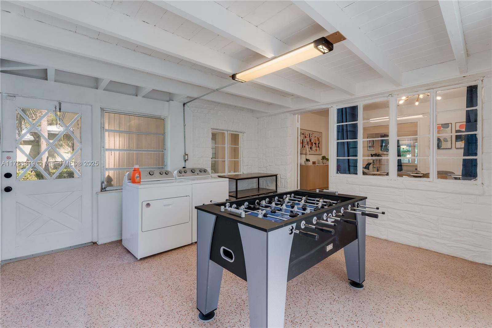 820 Southwest 26th Road Miami, FL 33129 - Photo 21 of 25 a kitchen that has a lot of cabinets in it