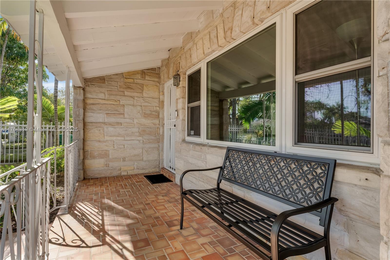 820 Southwest 26th Road Miami, FL 33129 - Photo 22 of 25 a view of two chairs in the balcony