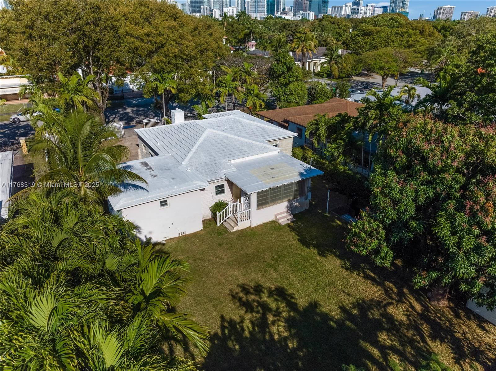 820 Southwest 26th Road Miami, FL 33129 - Photo 25 of 25 an aerial view of a house with a yard