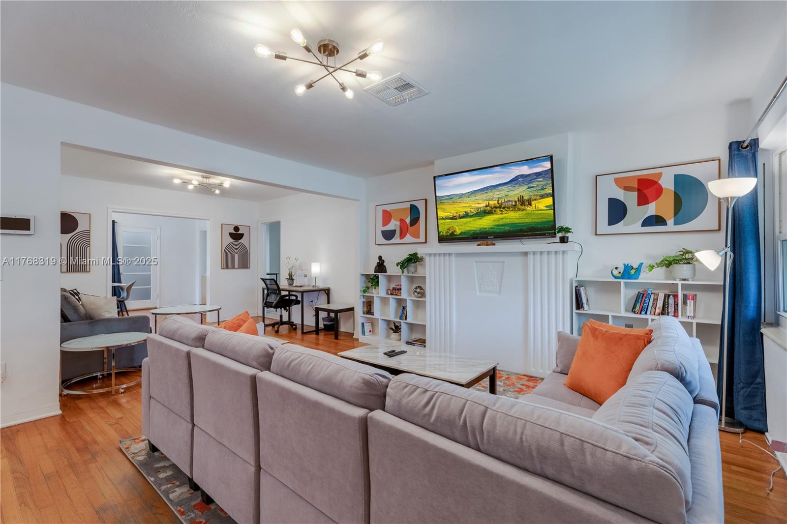 820 Southwest 26th Road Miami, FL 33129 - Photo 5 of 25 a living room with furniture and kitchen view