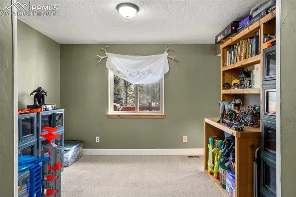 a view of a storage & utility room with a window