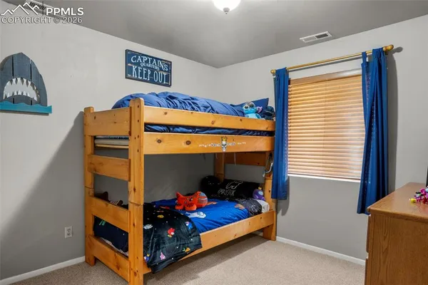 a bedroom with bunk bed