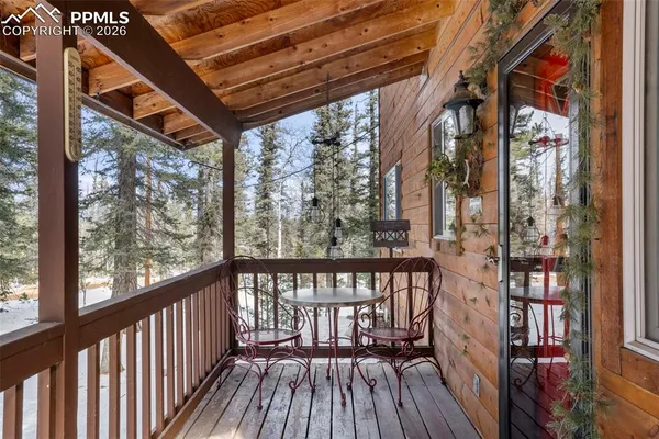 a view of a balcony with wooden floor