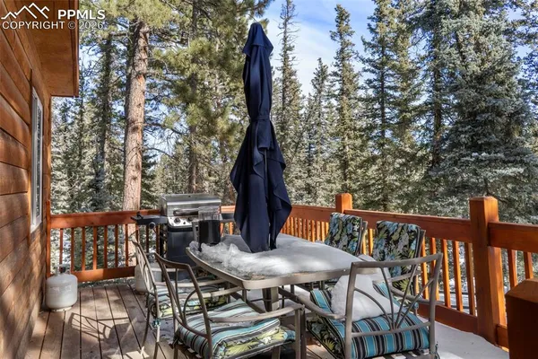 a view of a balcony with furniture