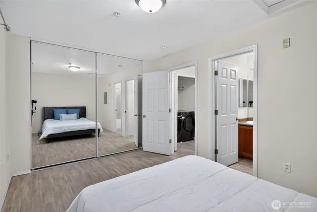 a bedroom with a bed and a mirror