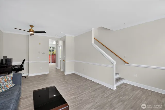 a view of a hallway view with wooden floor and staircase