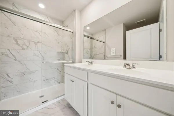 a bathroom with a bathtub and a sink
