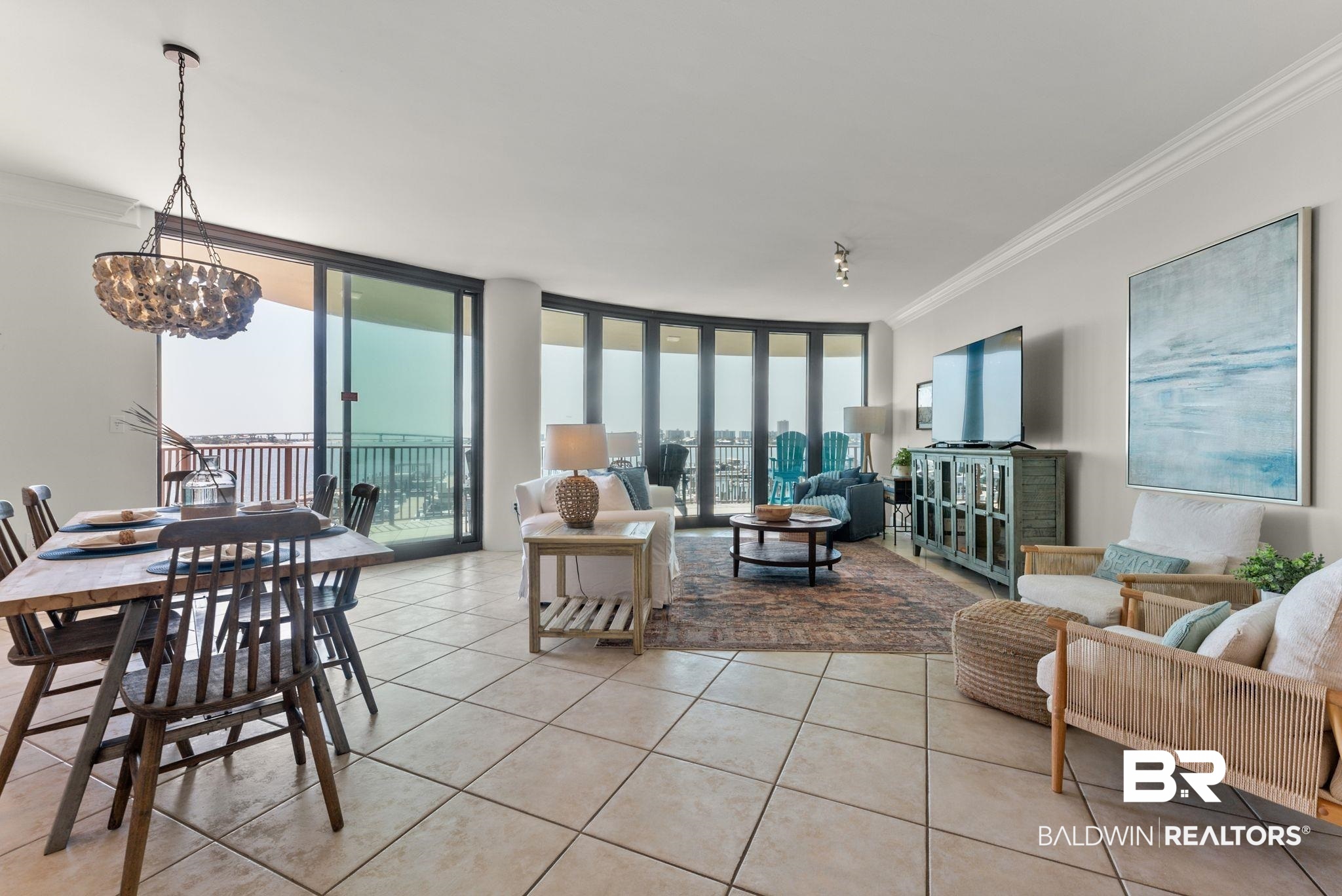 27580 Canal Road, Unit 1233 Orange Beach, AL 36561 - Photo 49 of 79 Living room with ornamental molding, light tile patterned floors, and floor to ceiling windows