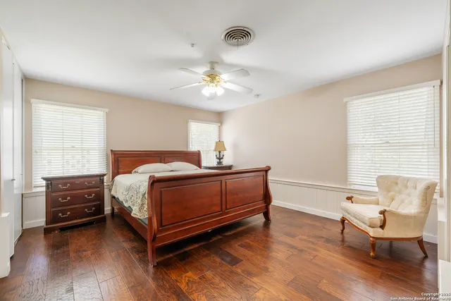 a bedroom with a bed and a couch