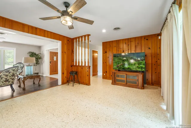 a view of a livingroom with furniture and a flat screen tv