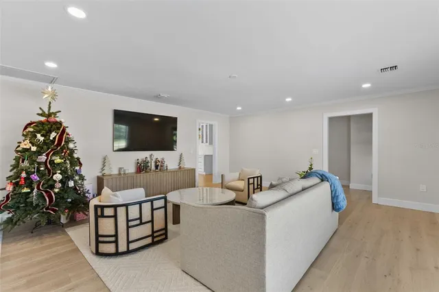 a large white bed in a white room