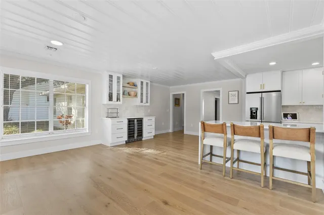 a living room with furniture and a book shelf