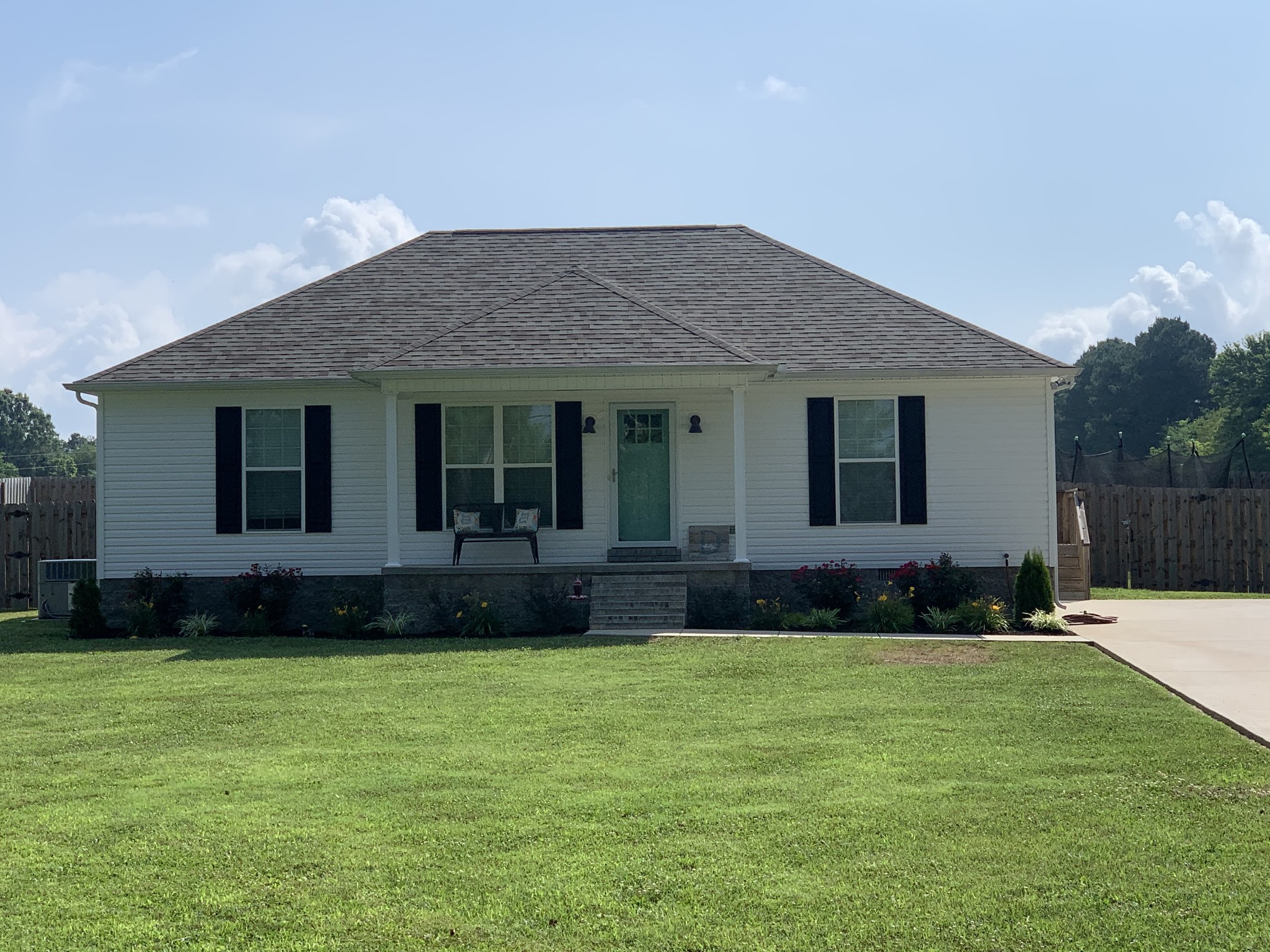 888 Prosser Road Leoma, TN 38468 - Photo 1 of 11 a front view of a house with a garden