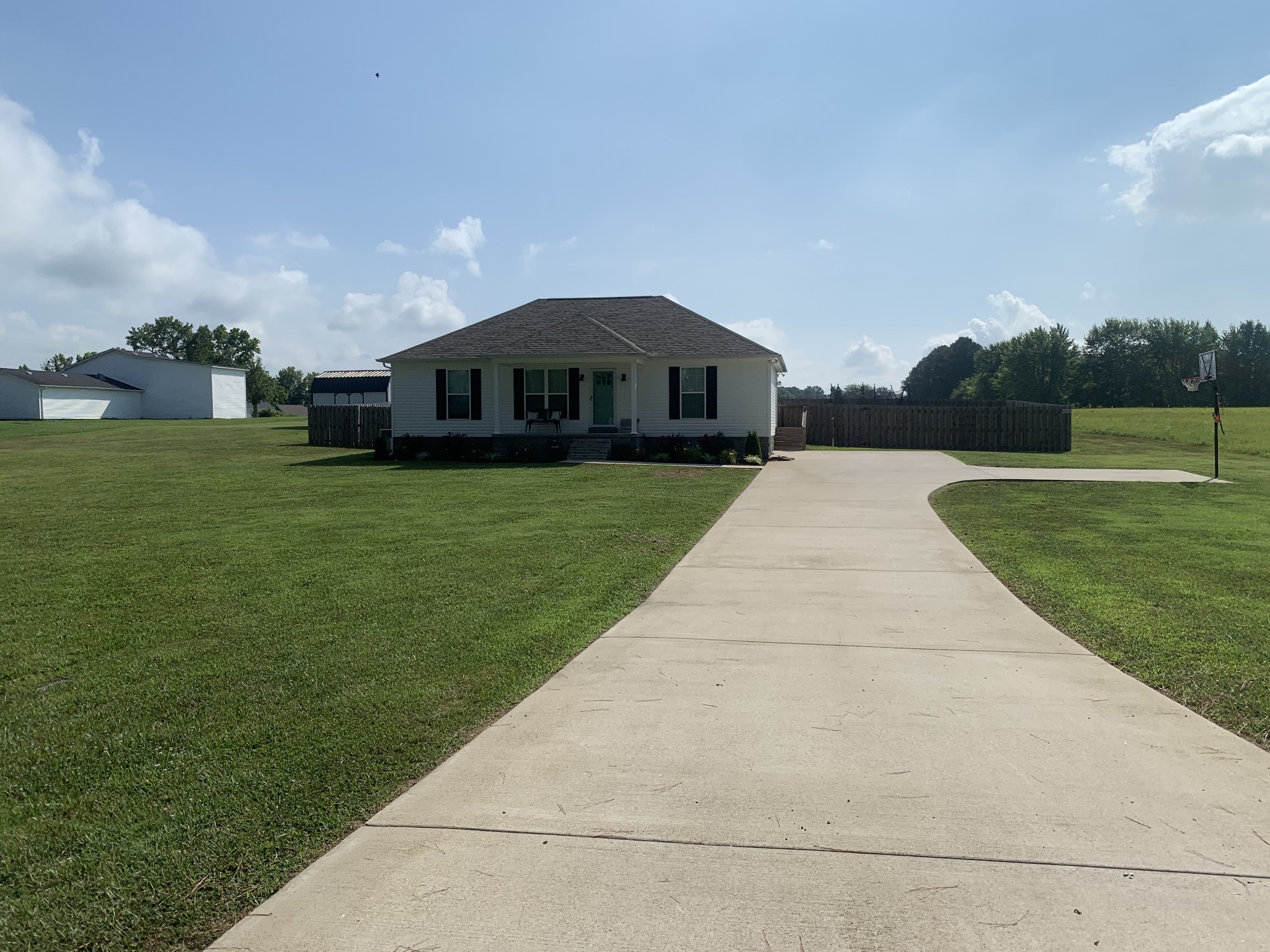 888 Prosser Road Leoma, TN 38468 - Photo 2 of 11 a front view of a house with garden