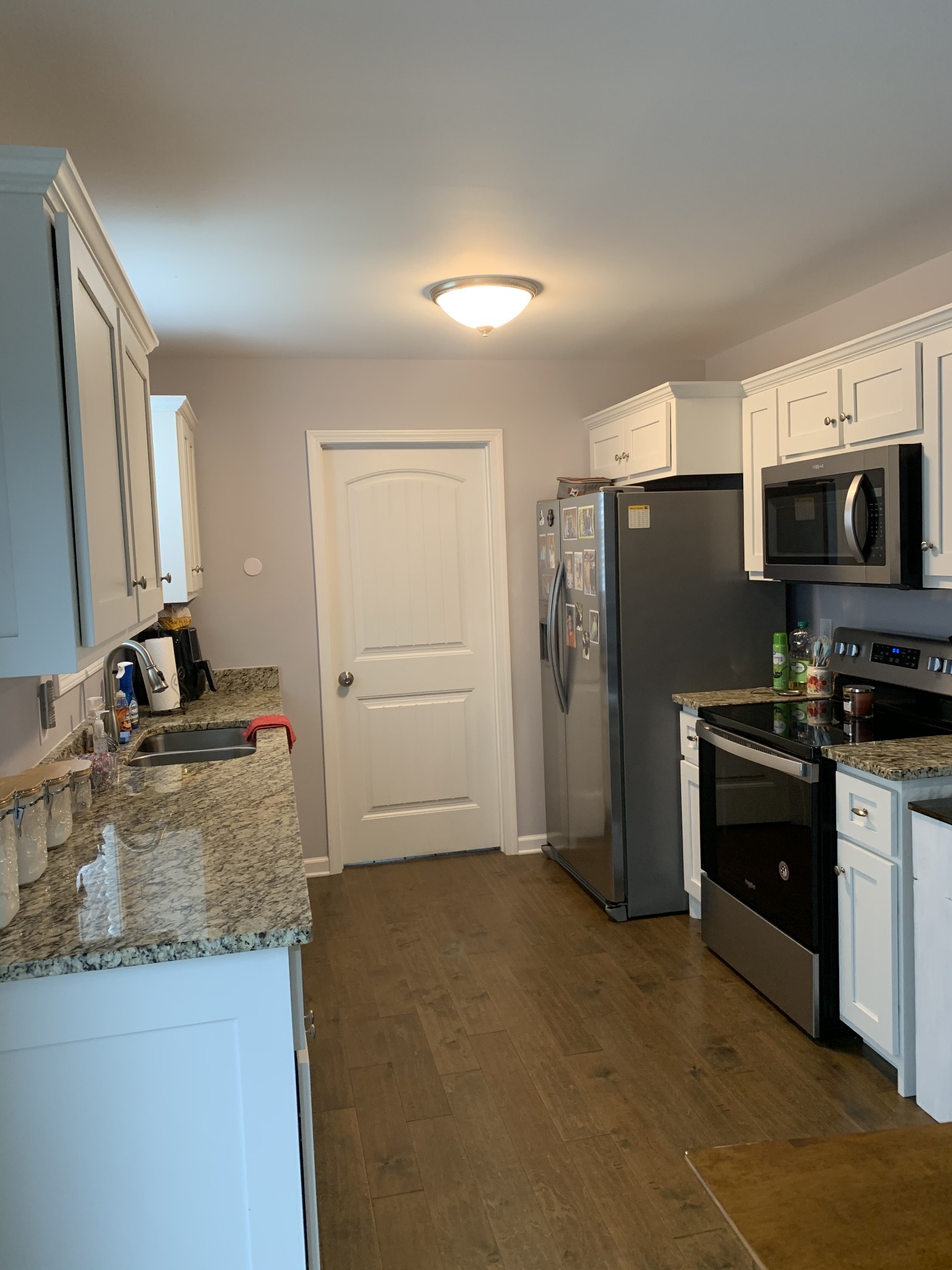 888 Prosser Road Leoma, TN 38468 - Photo 3 of 11 a kitchen with granite countertop a refrigerator stove and sink