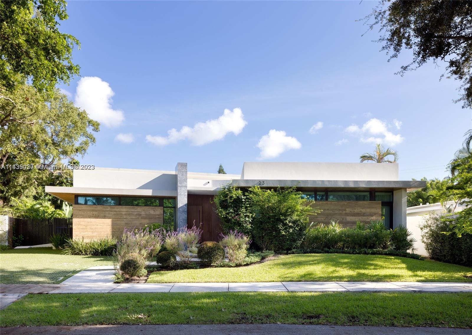 a view of a house with swimming pool and yard