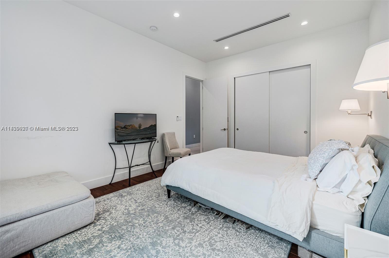 23 Samana Drive Miami, FL 33133 - Photo 11 of 19 a bedroom with a bed and a couch