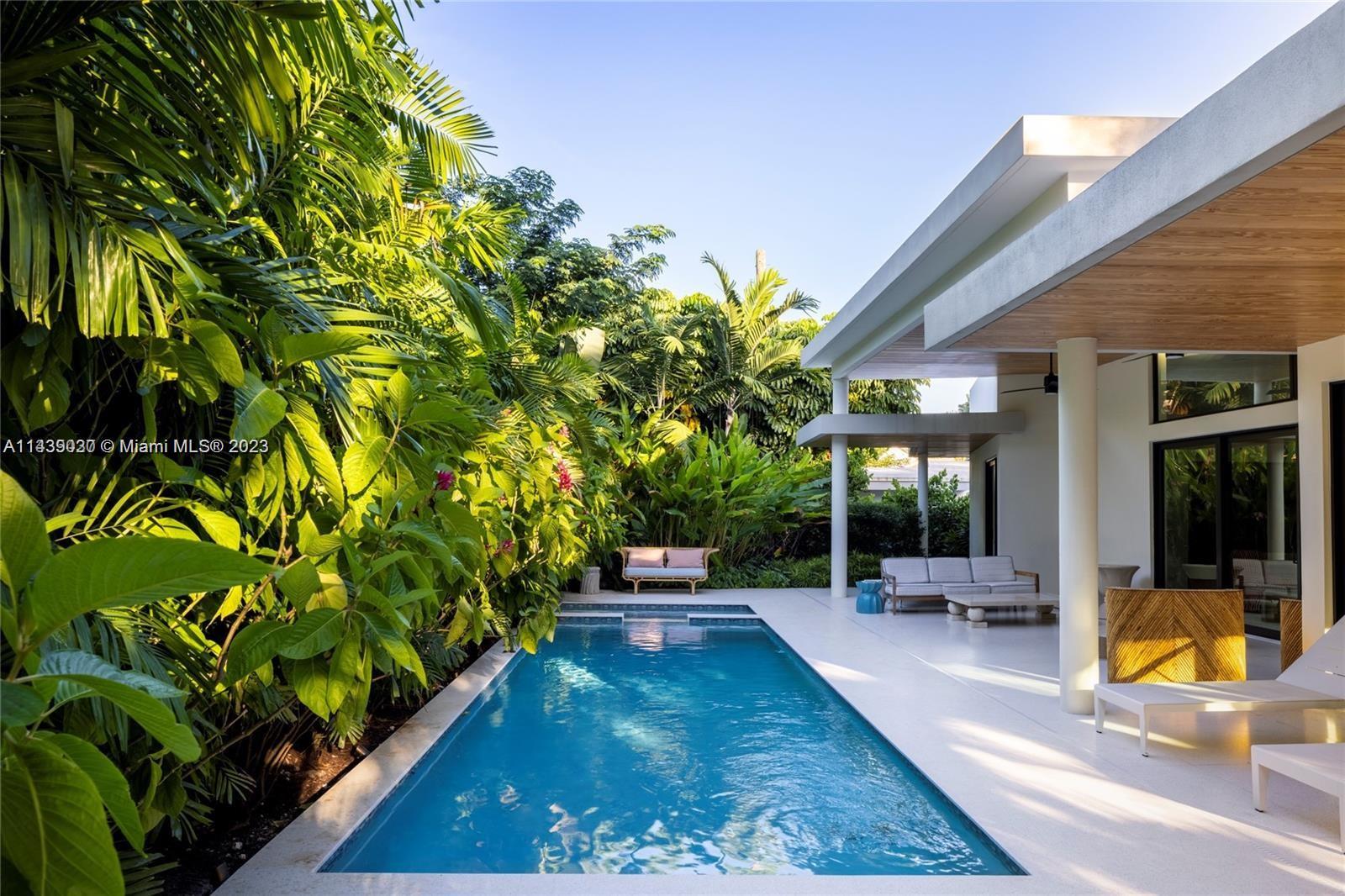 23 Samana Drive Miami, FL 33133 - Photo 16 of 19 a view of outdoor space yard deck patio and swimming pool