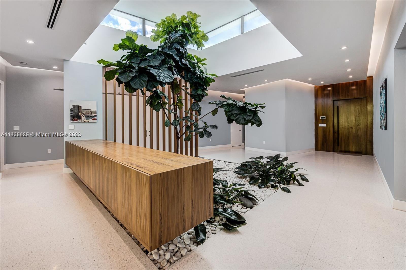 23 Samana Drive Miami, FL 33133 - Photo 5 of 19 a view of entryway with flower plant