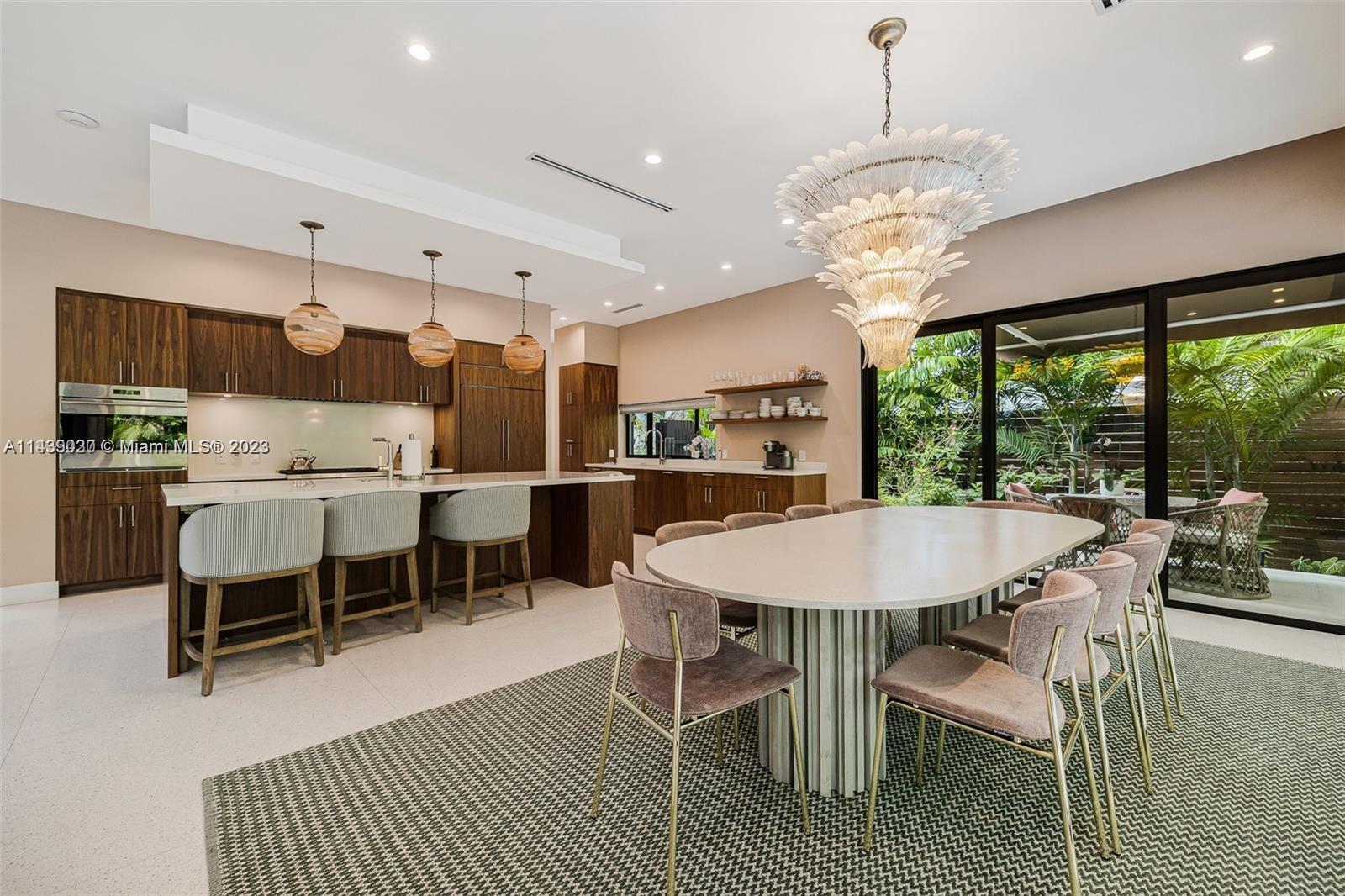 23 Samana Drive Miami, FL 33133 - Photo 8 of 19 a view of a dining room with furniture window and outside view