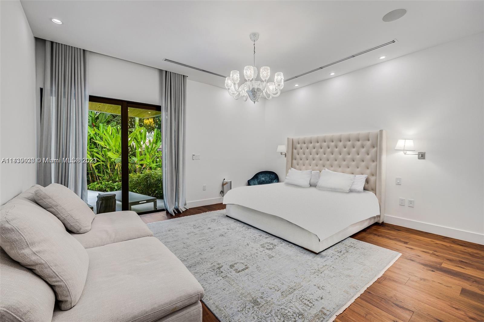 23 Samana Drive Miami, FL 33133 - Photo 9 of 19 a bedroom with a large bed and a large window