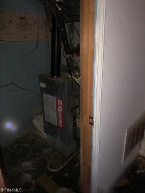 1114 Tipton Street High Point, NC 27262 - Photo 4 of 10 Basement Mechanical Room: Here we can see the natural gas forced warm air furnace