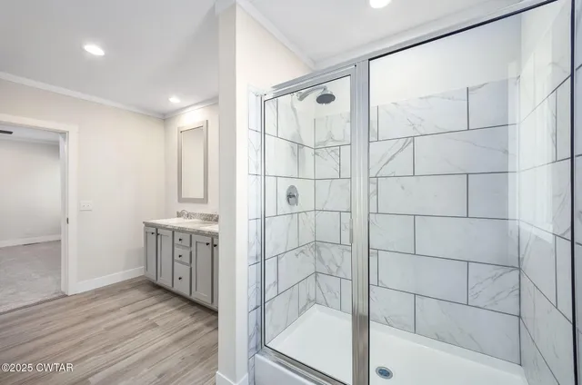 a bathroom with a bathtub and a shower